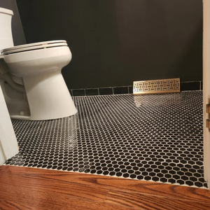 Powder room floor black polished hexagon porcelain mosaic